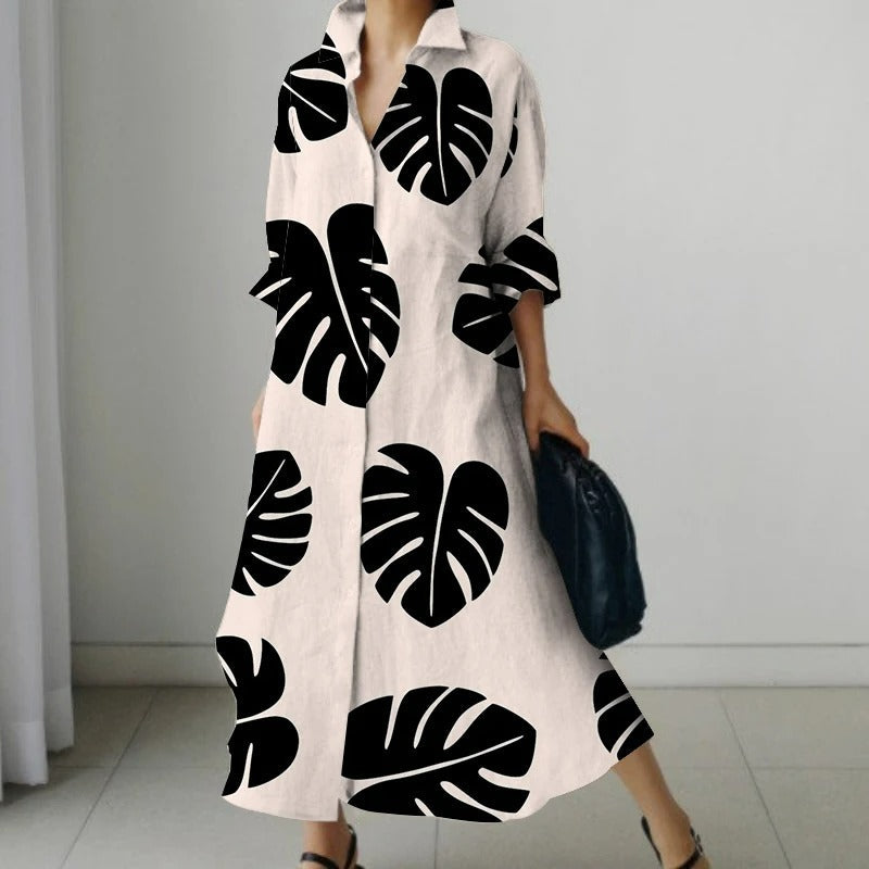Zwarte comfortabele blouse jurk met bloemenprint en v-hals