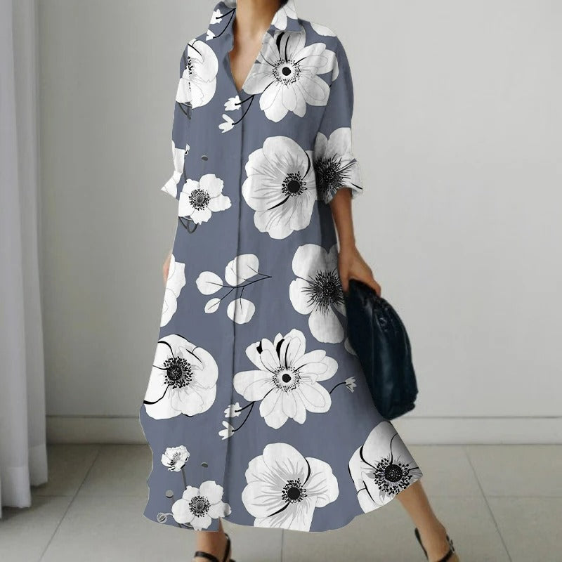 NIMA Elegante zwarte blouse jurk met bloemenprint en draaikraag