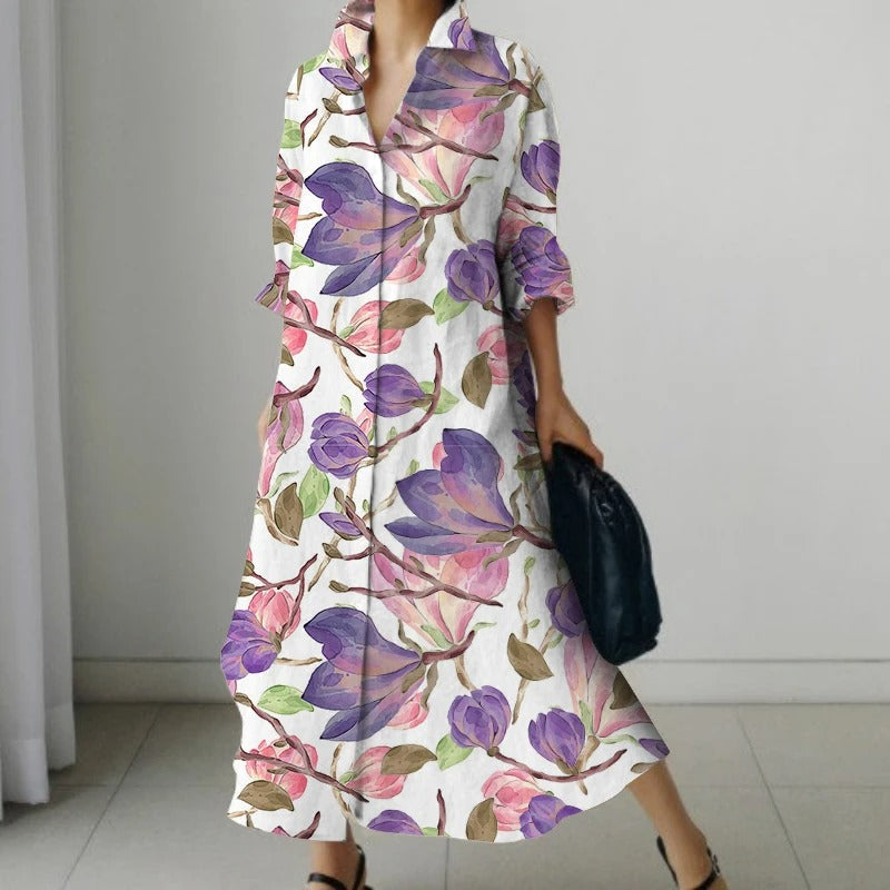 NIMA Elegante zwarte blouse jurk met bloemenprint en draaikraag