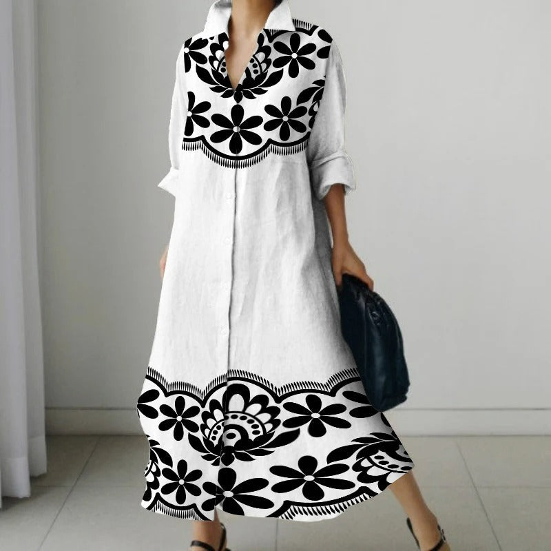 NIMA Elegante zwarte blouse jurk met bloemenprint en draaikraag