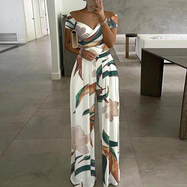 NIMA Maxi jumpsuit print off-shoulder v-hals