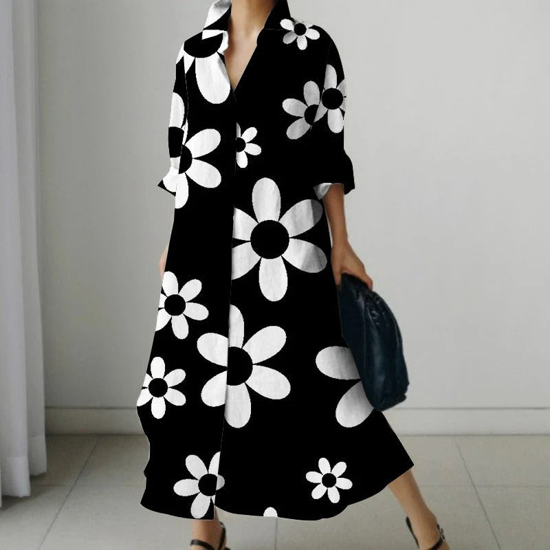 Zwarte comfortabele blouse jurk met bloemenprint en v-hals