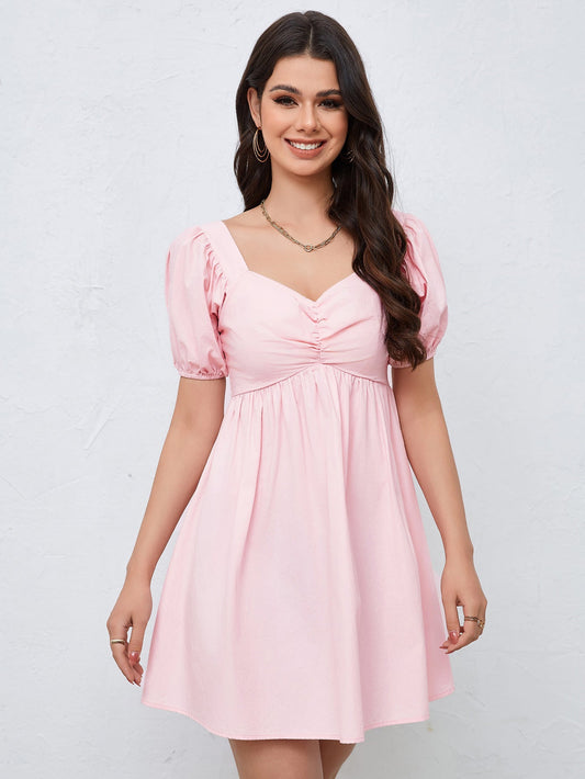 NIMA afslankende taille roze mini jurk