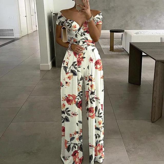 NIMA Maxi jumpsuit Whiteh print, off-the-shoulder and V-neck
