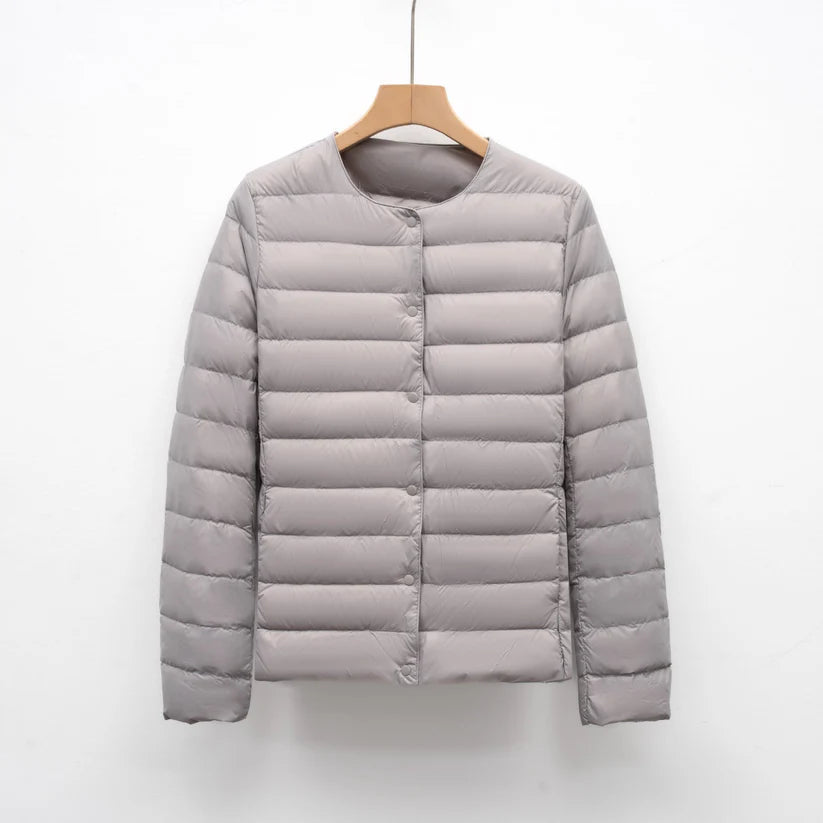 Freja – lightweight fitted down jacket with snap closure