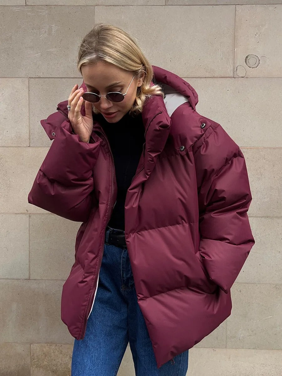 Padded women's jacket with hood - warm down jacket in a short model