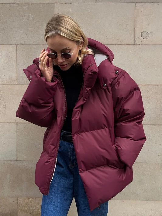 Padded women's jacket with hood - warm down jacket in a short model