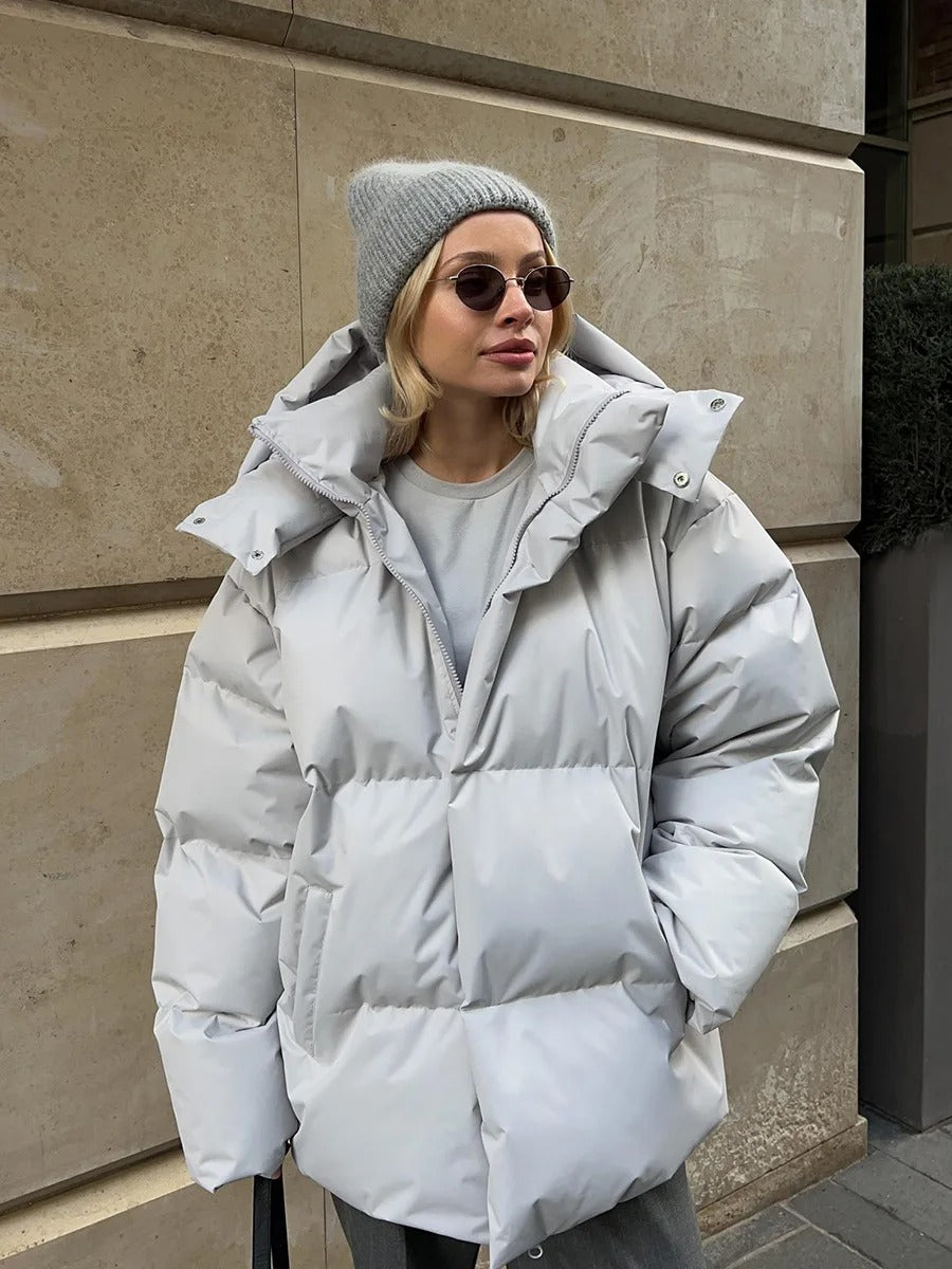 Padded women's jacket with hood - warm down jacket in a short model